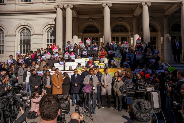 Councilmember Chi Ossé, D-Brooklyn, center, addresses a rally outside of City Hall in support of the FARE Act ahead of a City Council meeting, Wednesday, Nov. 13, 2024, in New York. (AP Photo/Adam Gray)