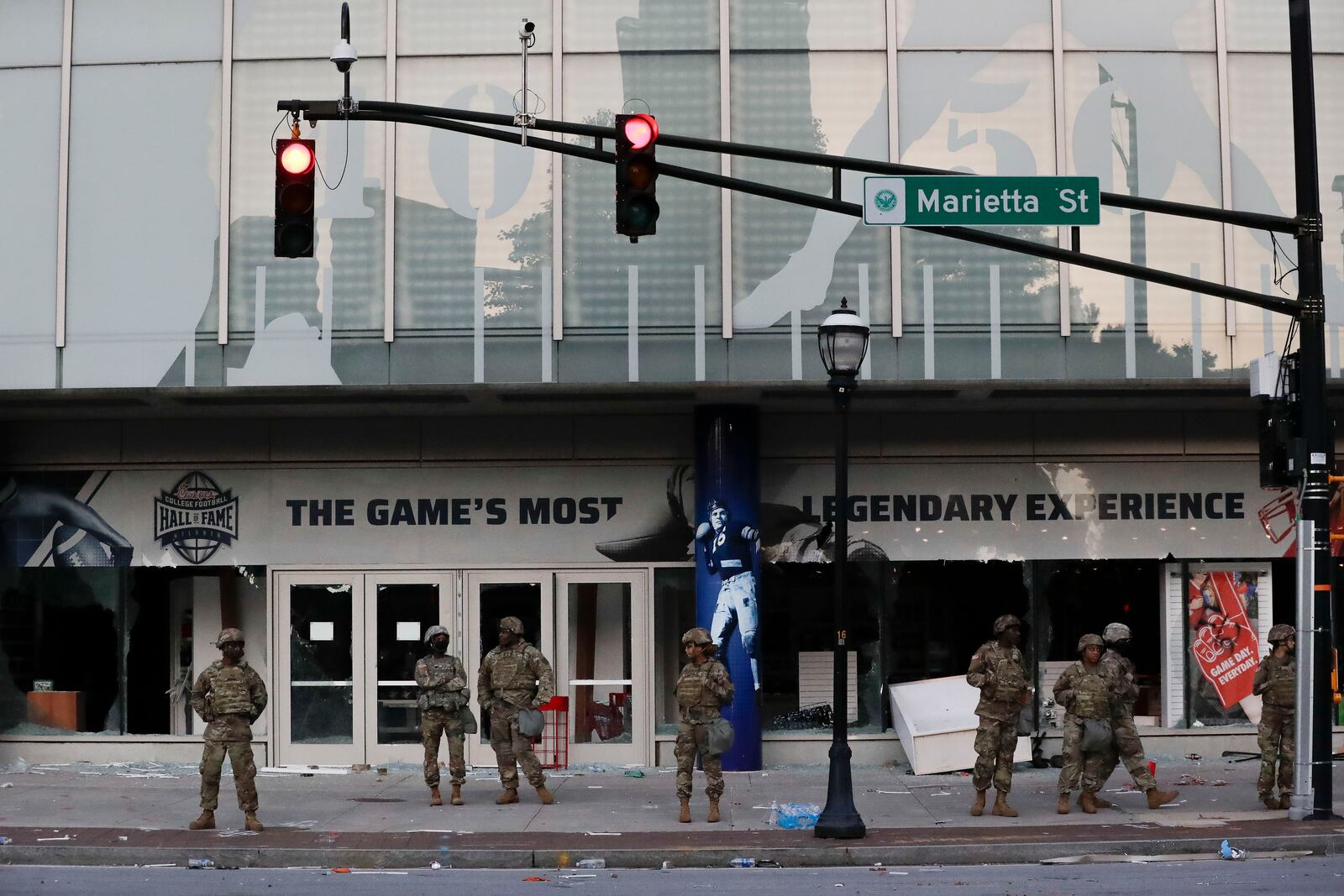 Members of the Georgia National Guard stand in front of the of the College Football Hall of Fame Saturday. (AP Photo/Brynn Anderson)