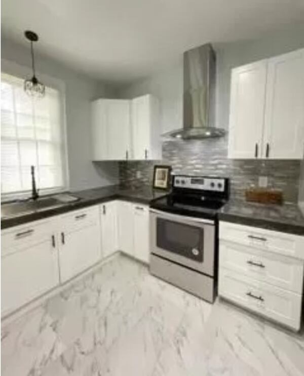 The fully renovated ranch has stainless steel appliances.