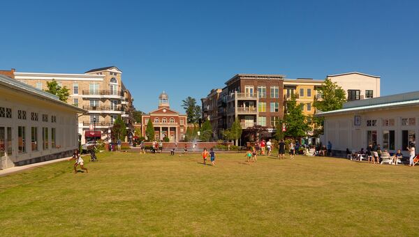 The town green at Alpharetta City Center is flanked by two restaurants in jewel box buildings, Botiwalla (left) and Charinga (right). Photo credit: Morris & Fellows.