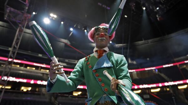 A Ringling Bros. and Barnum & Bailey clown juggles for fans during a pre show Saturday, Jan. 14, 2017, in Orlando, Fla. The Ringling Bros. and Barnum & Bailey Circus will end the "The Greatest Show on Earth" in May, following a 146-year run of performances. Kenneth Feld, the chairman and CEO of Feld Entertainment, which owns the circus, told The Associated Press, declining attendance combined with high operating costs are among the reasons for closing. (AP Photo/Chris O'Meara)