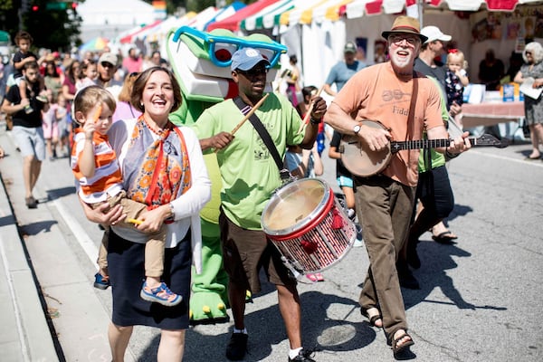 Among the activities each year at the AJC Decatur Book Festival is the parade, which this year featured children’s author and Grand Marshal Carmen Agra Deedy, left. BRANDEN CAMP/SPECIAL