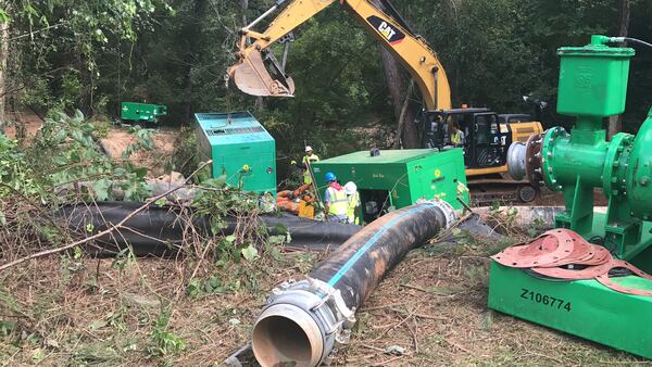 Friday morning at the site of a sewage spill on Eagle’s Beek Circle in Lithonia. TYLER ESTEP / TYLER.ESTEP@AJC.COM