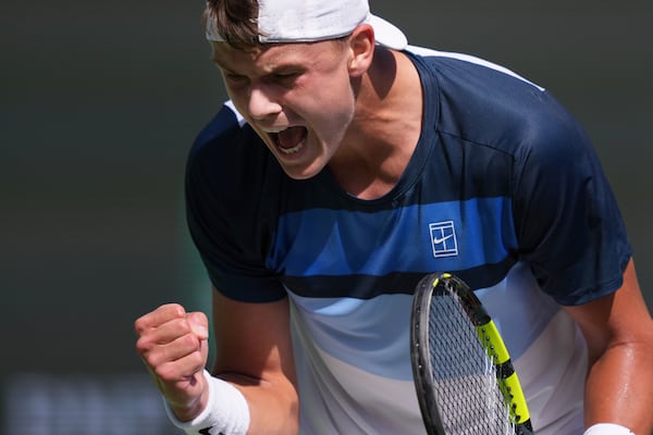 Holger Rune, of Denmark, celebrates a point against Daniil Medvedev, of Russia, during their semifinals match at the BNP Paribas Open tennis tournament Saturday, March 15, 2025, in Indian Wells, Calif. (AP Photo/Mark J. Terrill)