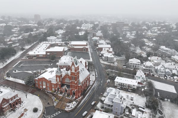 Snow falls on downtown Macon on Tuesday.