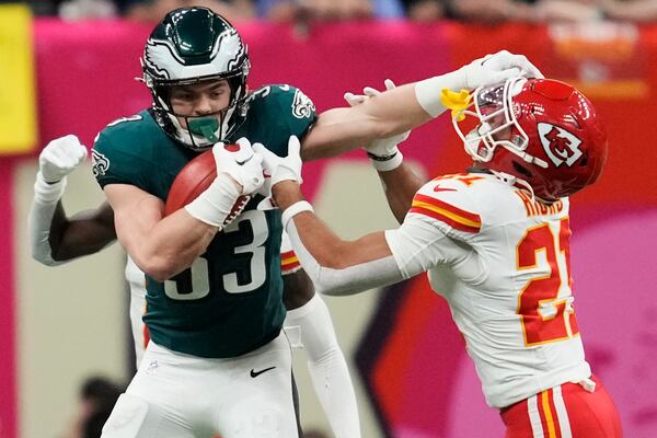 Philadelphia Eagles linebacker Zack Baun (53) stiff arms Kansas City Chiefs defensive back Jaden Hicks (21) during the first half of the NFL Super Bowl 59 football game, Sunday, Feb. 9, 2025, in New Orleans. (AP Photo/Ashley Landis)