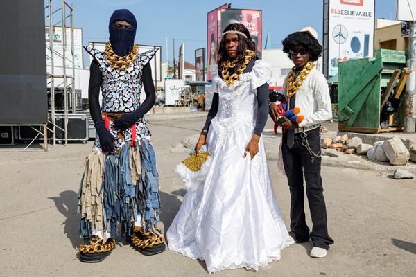 Attendees at a thrift and an upcycle show pose for a photograph in Accra, Ghana, Sunday, Oct. 27, 2024. (AP Photo/Misper Apawu)