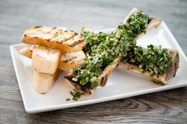  Roasted Bone Marrow Canoes with smoked salt, parsley salad, and rustic bread. Photo credit- Miai Yakel.