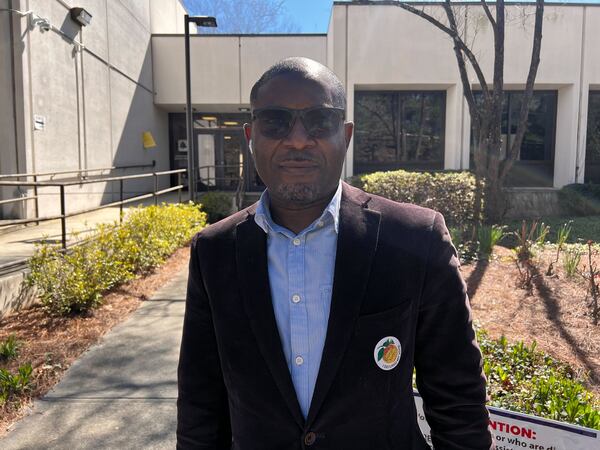 Frank Anetole Houeffa voted Tuesday at the North Fulton Government Service Center.