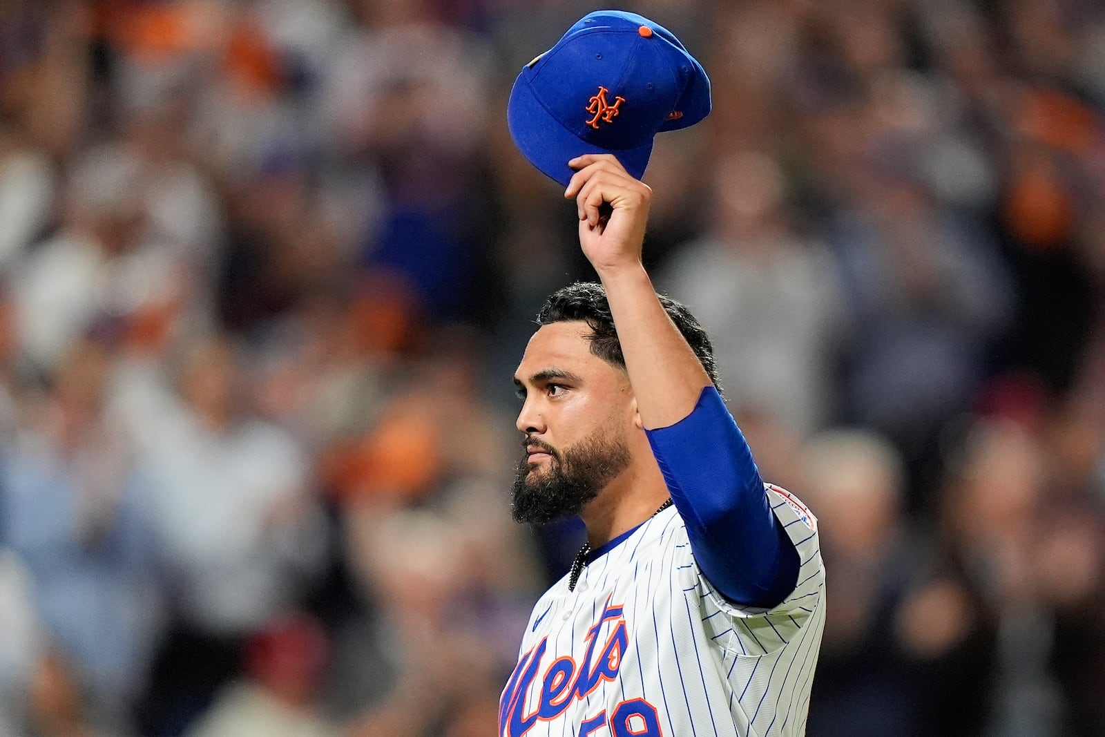 New York Mets pitcher Sean Manaea (59) reacts as he walks off the field during the eighth inning of Game 3 of the National League baseball playoff series against the Philadelphia Phillies, Tuesday, Oct. 8, 2024, in New York. (AP Photo/Frank Franklin II)