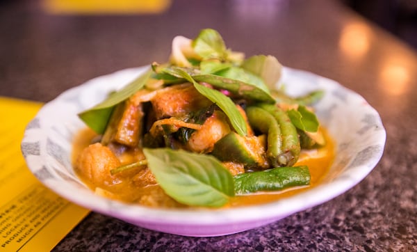  Talat Market serves a Thai red curry catfish with eggplant, rattlesnake beans, lime basil, ginger and pickled green tomatoes. / (Jenni Girtman/ Atlanta Event Photography)