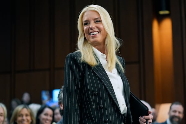 Pam Bondi, President-elect Donald Trump's choice to lead the Justice Department as attorney general, arrives to appear before the Senate Judiciary Committee for her confirmation hearing, at the Capitol in Washington, Wednesday, Jan. 15, 2025. (AP Photo/J. Scott Applewhite)