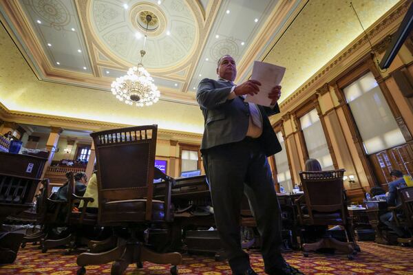 Rep. Devan Seabaugh, R-Marietta, walks in the House Chambers during day 40 of the legislative session at the State Capitol on Wednesday, March 29, 2023. Jason Getz / Jason.Getz@ajc.com)
