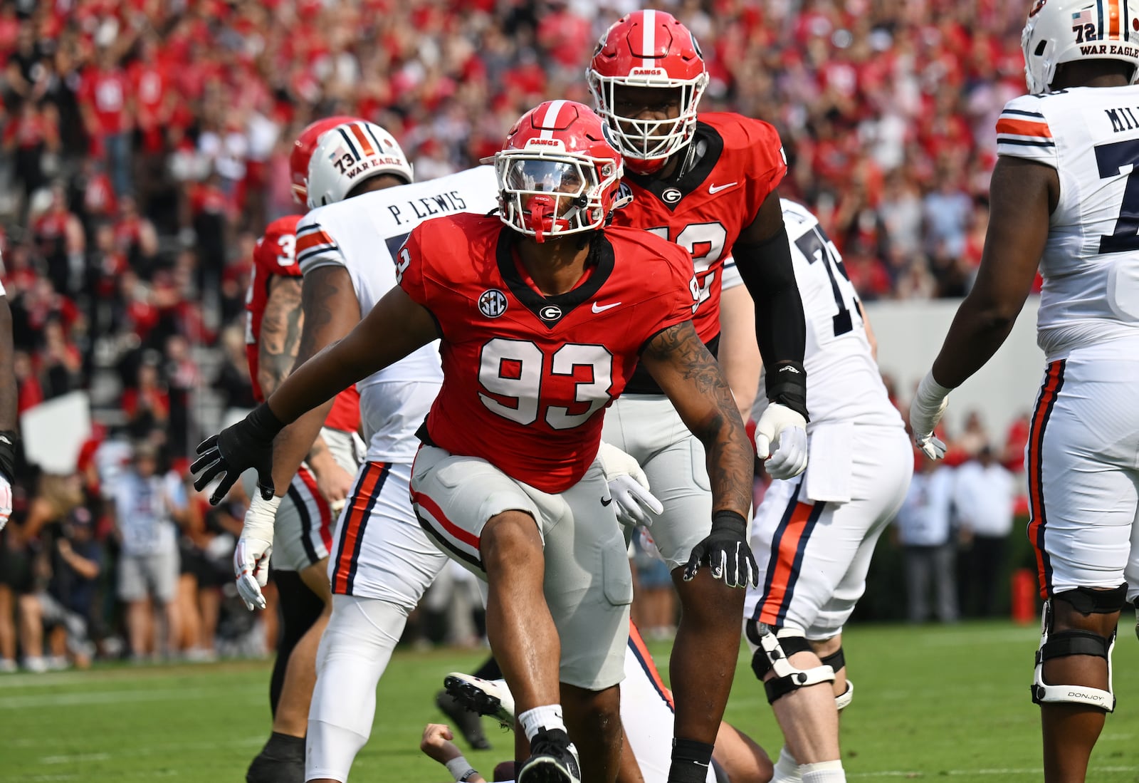 Georgia defensive lineman Tyrion Ingram-Dawkins (93) reacts after sacking Auburn quarterback Payton Thorne (1) during the first half in an NCAA football game at Sanford Stadium, Saturday, October 5, 2024, in Athens. (Hyosub Shin / AJC)