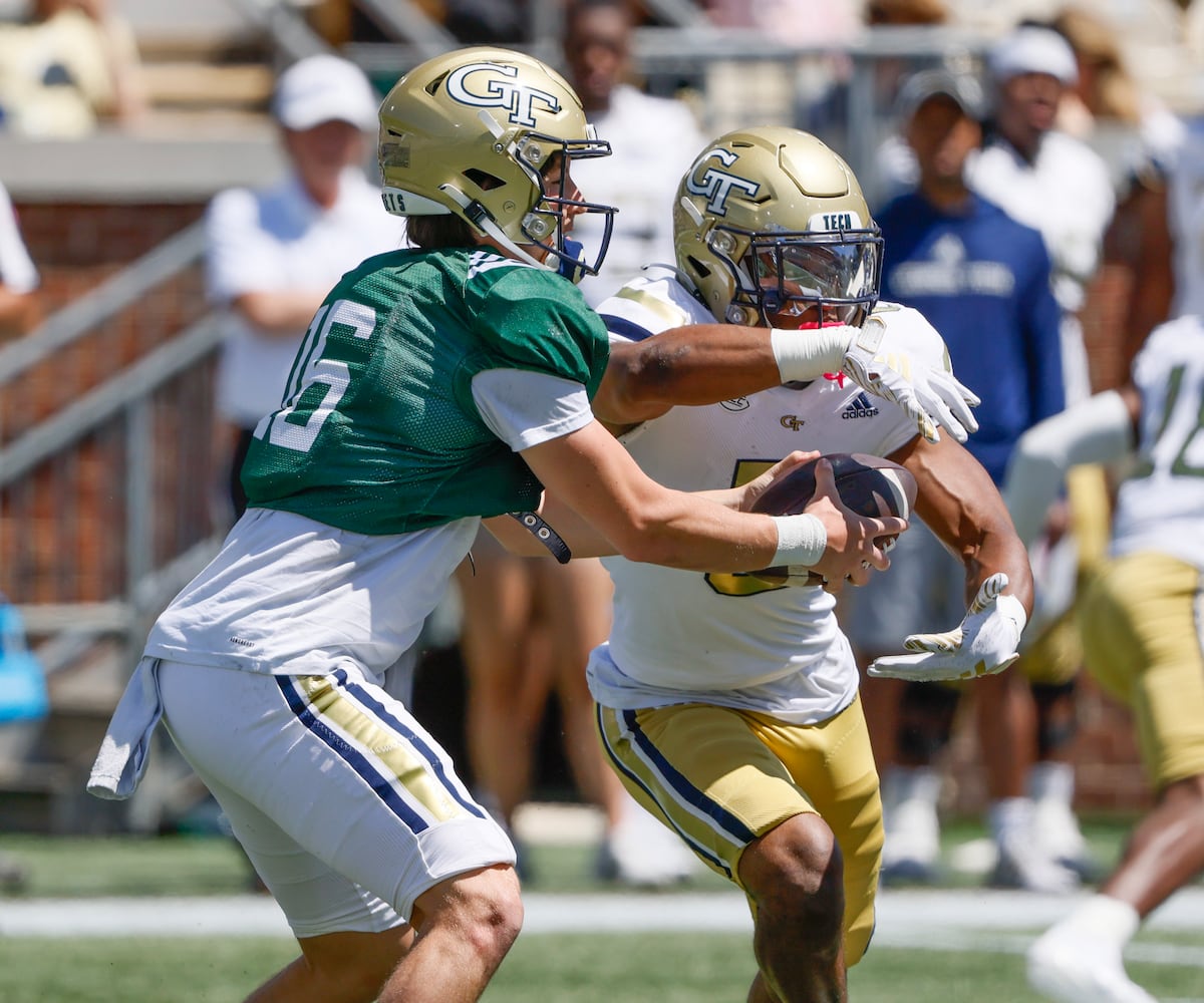 Georgia Tech quarterback Brody Rhodes (16) fakes the handoff to Georgia Tech running back Anthony Carrie (6) and runs during the Spring White and Gold game at Bobby Dodd Stadium at Hyundai Field In Atlanta on Saturday, April 13, 2024.   (Bob Andres for the Atlanta Journal Constitution)