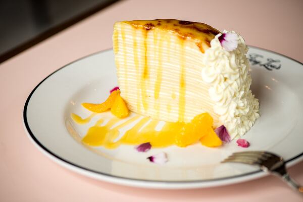  Crepe Suzette Cake dessert with thin French crepes, orange cream, warm beurre suzette, and citrus. Photo credit- Mia Yakel.