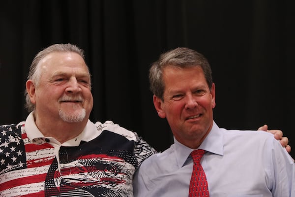 Cobb County Sheriff Neil Warren greets Georgia Gov. Brian Kemp during the annual Corn Boilin’ at Jim Miller Park in Marietta. The event is Warren’s largest political fundraiser, and generates tens of thousands of dollars every year. The sheriff’s campaign is currently under investigation by the state ethics commission, and a review of his campaign finance reports found incomplete disclosure of contributors and spending. Christina Matacotta/Christina.Matacotta@ajc.com