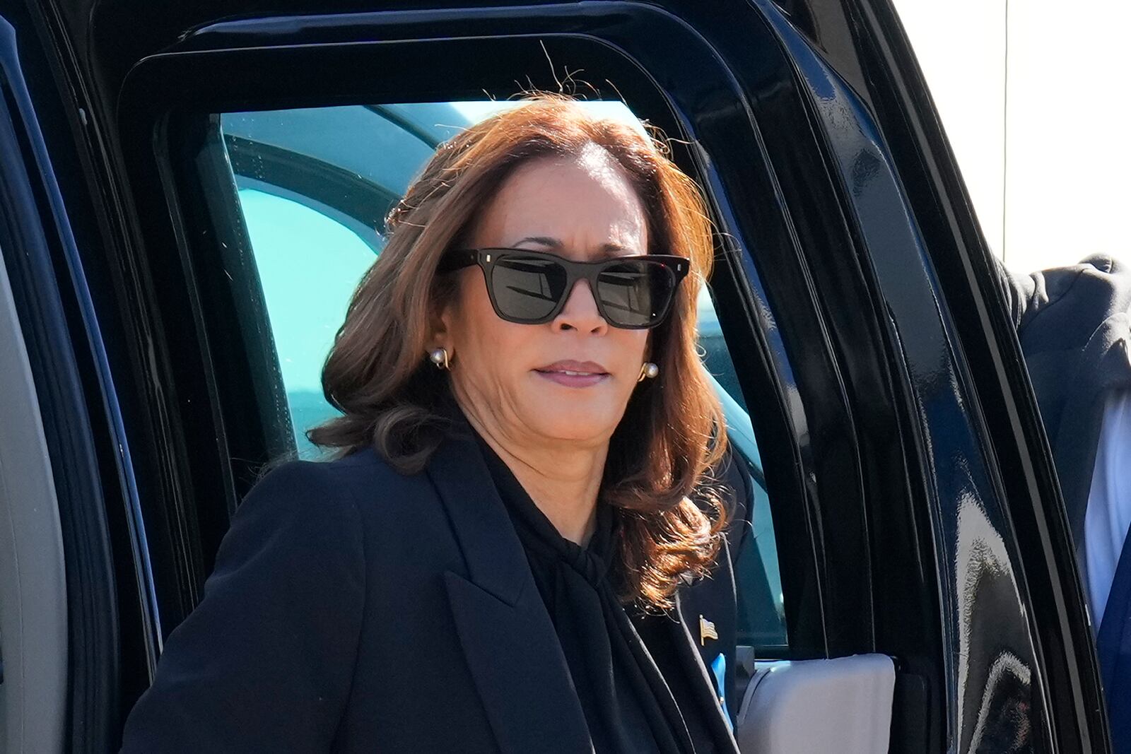 Democratic presidential nominee Vice President Kamala Harris steps out of her vehicle as she prepares to board Air Force Two at LaGuardia Airport in East Elmhurst, N.Y., Wednesday, Sept. 11, 2024. (AP Photo/Jacquelyn Martin)