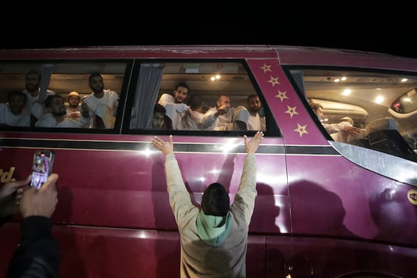 Freed Palestinian prisoners are greeted as they arrive in the Gaza Strip after being released from an Israeli prison following a ceasefire agreement between Hamas and Israel in Khan Younis, Gaza Strip, Thursday, Feb. 27, 2025. (AP Photo/Jehad Alshrafi)