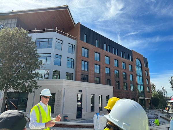 The new Trilith Guesthouse hotel, opening in early 2024, was two years in the making and is led by James Green, general manager (left). It is a five-story, 193-room  boutique hotel with 36 apartment-style studios and one-bedroom suites; a street-level restaurant; fifth-floor rooftop bar; culinary studio; and indoor/outdoor event spaces spanning more than 17,000 square feet. RODNEY HO/rho@ajc.com