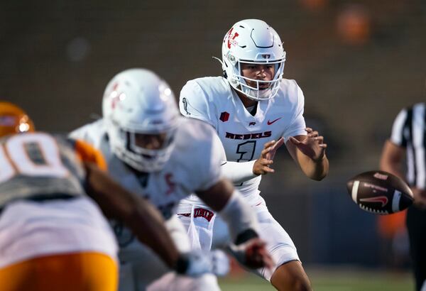 UNLV quarterback Jayden Maiava (1) grabs the snap during the first half an NCAA college football game against UTEP on Saturday, Sept. 23, 2023, in El Paso, Texas. (AP Photo/Andres Leighton)