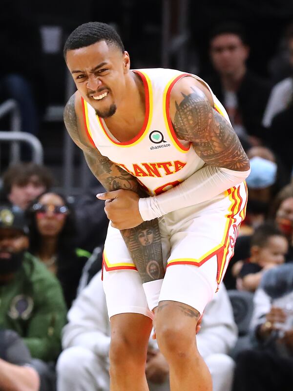 Hawks forward John Collins suffers an injury during the 4th period against the Phoenix Suns in a NBA basketball game on Thursday, Feb. 3, 2022, in Atlanta.  “Curtis Compton / Curtis.Compton@ajc.com”`