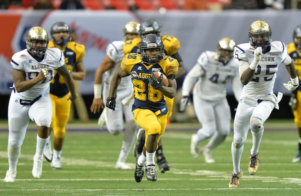 North Carolina A&T running back Tarik Cohen (28) runs for a touchdown during North Carolina A&T's 41-34 win over Alcorn State in the 2015 Celebration Bowl at the Georgia Dome on Saturday December 19, 2015. HYOSUB SHIN / HSHIN@AJC.COM