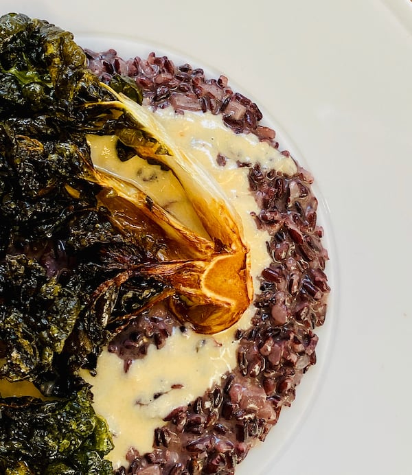 Black Venere rice, parmigiano cream, four peppercorns, crispy bok choi from Lyla Lila.