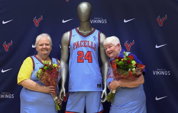 Sister Margaret Downing (left) and Sister Pat Thompson, both of the Sisters of Mercy, were recognized at St. Anne-Pacelli Catholic School on Dec. 9, 2024, with a ceremony honoring them. Both are retiring, and the school unveiled a special basketball jersey in their honor. (Photo Courtesy of Mike Haskey)