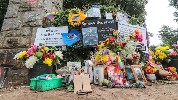 Mourners left flowers at a makeshift memorial for Katherine Janness last year after the 40-year-old Midtown resident was found stabbed to death alongside her dog, Bowie.
(John Spink / John.Spink@ajc.com)

