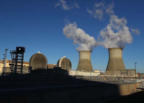 121421 Waynesboro: Containment vessels surround the existing site units 1 and 2 at Plant Vogtle beside their cooling towers on Tuesday, Dec 14, 2021, in Waynesboro.   “Curtis Compton / Curtis.Compton@ajc.com”`