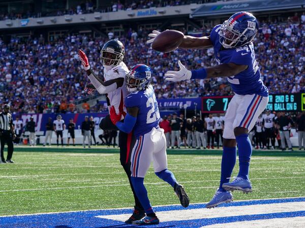 New York Giants cornerback James Bradberry (24) misses a potential intercept on a pass intended for Falcons tight end Kyle Pitts (center left) in the end zone during the second half Sunday, Sept. 26, 2021, in East Rutherford, N.J. (Seth Wenig/AP)