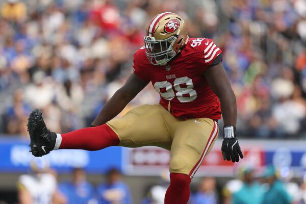 FILE - San Francisco 49ers defensive tackle Javon Hargrave (98) celebrates after sacking Los Angeles Rams quarterback Matthew Stafford during the first half of an NFL football game, Sept. 22, 2024, in Inglewood, Calif. (AP Photo/Ryan Sun, File)