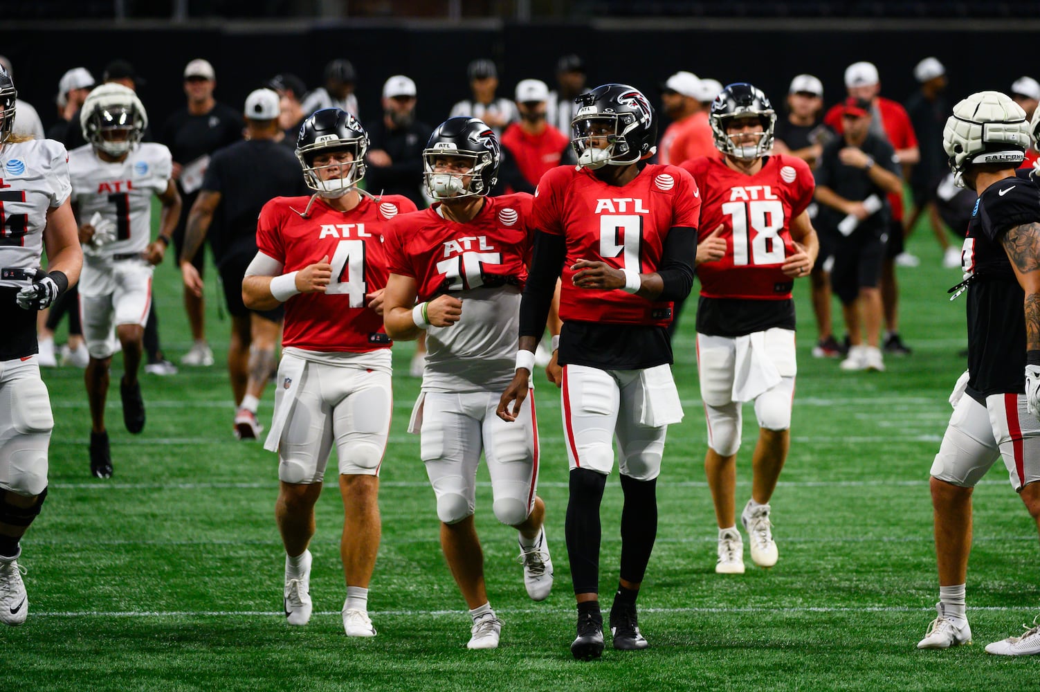 Falcons quarterbacks move across the field. (Jamie Spaar for the Atlanta Journal Constitution)