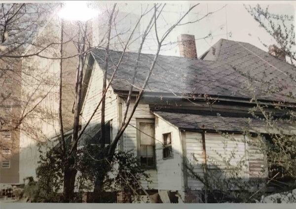 Bobby Crook’s Home: Taken in 1965 in Linnentown during urban renewal. Crook lived at 167 Peabody Street. This photo shows the back of his childhood house in Linnentown with the newly constructed Brumby Hall dormitory for women in the background. Crook’s house was the last house to be demolished. Courtesy of Hargrett Rare Book and Manuscript Library - The University of Georgia Special Collections Libraries