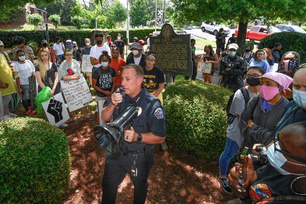 Kennesaw Police Chief Bill Westenberger speaks to a group of demonstrates across the street from a Confederate-era memorabilia shop, during a protest held Friday, June 5, 2020, in Kennesaw. Protests around the nation are occurring to sound off against the killing of George Floyd in Minneapolis police custody. JOHN AMIS FOR THE ATLANTA JOURNAL-CONSTITUTION