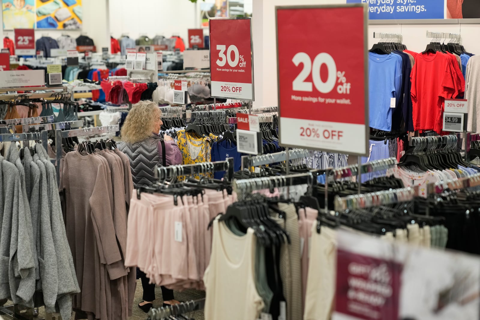 A shopper looks at clothes at a Kohl's in Ramsey, N.J., Thursday, Oct. 10, 2024. (AP Photo/Seth Wenig)