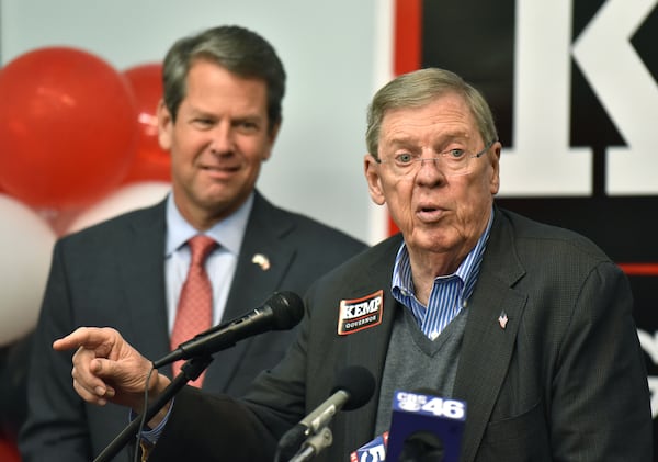 November 5, 2018 Atlanta - U.S. Senator Johnny Isakson speaks as GOP gubernatorial candidate Brian Kemp looks Monday evening  just a day before the election day at Brian Kemp for Governor Headquarters in Buckhead on Monday, November 5, 2018. HYOSUB SHIN / HSHIN@AJC.COM