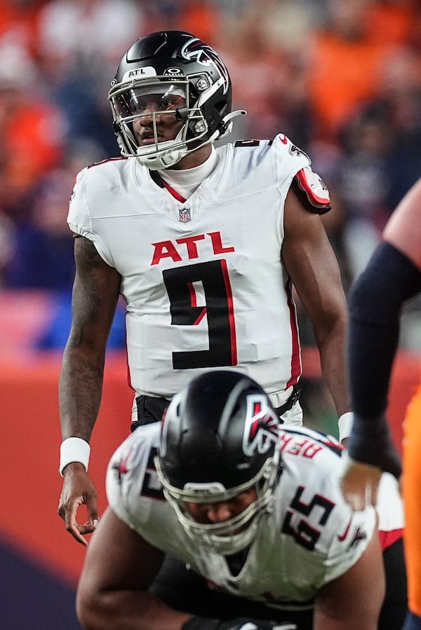 Atlanta Falcons quarterback Michael Penix Jr. (9) works against the Denver Broncos during the second half of an NFL football game, Sunday, Nov. 17, 2024, in Denver. (AP Photo/David Zalubowski)