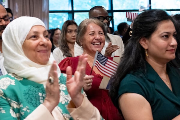 Sefika Dizdarevic, from Bosnia and Herzegovina, can’t hold back her joy as she is sworn in as a naturalized citizen during a ceremony at The Carter Center in Atlanta on Sunday, Oct. 1, 2023. The ceremony was held at the center in honor of President Jimmy Carter’s 99th birthday.   (Ben Gray / Ben@BenGray.com)