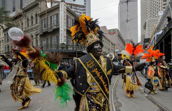 FILE - The Krewe of Zulu takes the turn onto Canal Street from St. Charles Avenue on Mardi Gras, Tuesday, Feb. 17, 2015, in New Orleans. (Matthew Hinton/The Advocate via AP, File)