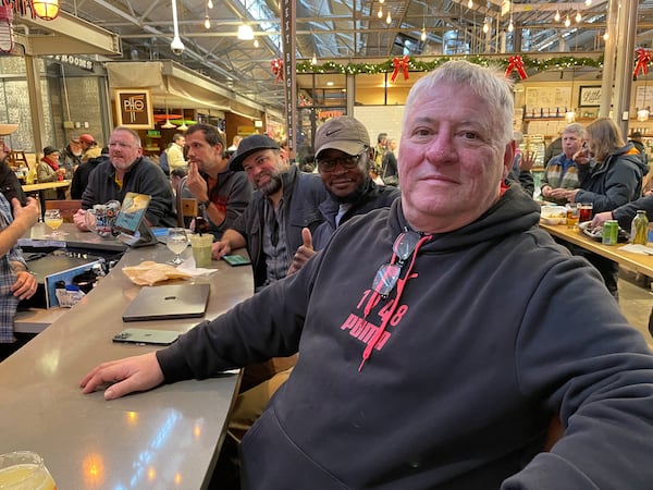 Bob Pugh of Atlanta enjoys a Two Tides IPA at Hop City Craft Beer & Wine at Krog Street Market. He says proposed cancer-risk warnings on alcoholic beverages wouldn't deter him. (Michael Scaturro/AJC)