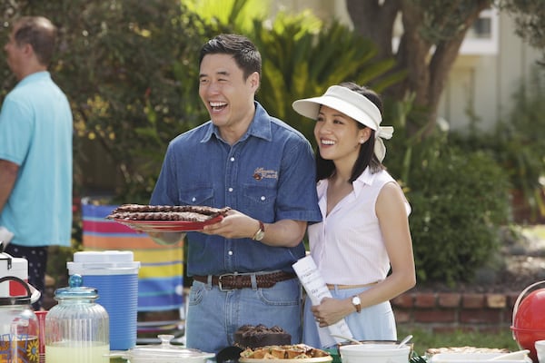 In this image released by ABC, Randall Park, left, and Constance Wu appear in a scene from the new comedy series “Fresh Off the Boat,” previewing Wednesday with episodes at 8:30 p.m. and 9:30 p.m. EST. (AP Photo/ABC, Nicole Wilder)