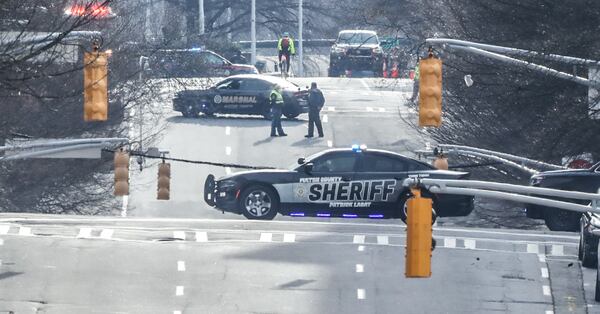 Atlanta police were on the scene Monday near an Underground Atlanta parking deck. (John Spink / John.Spink@ajc.com)