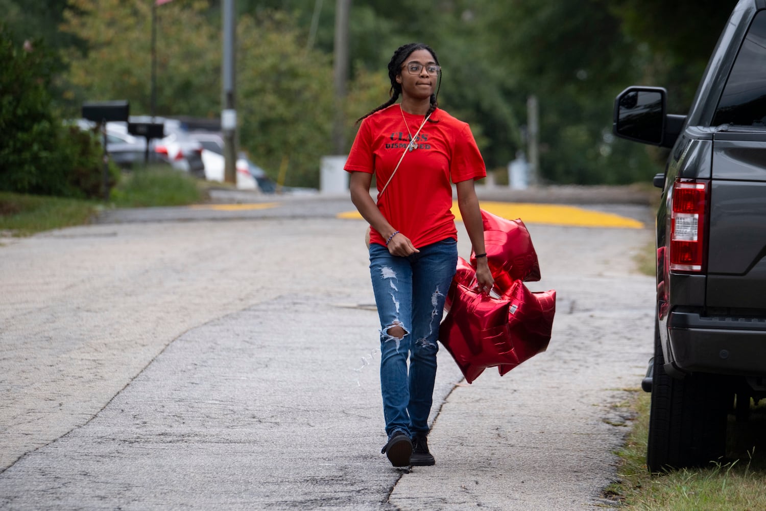 Divine Neely, a family friend of Apalachee High School shooting victim Mason Alexander Schermerhorn, arrives at his funeral in Jefferson on Saturday, Sept. 14, 2024.   Ben Gray for the Atlanta Journal-Constitution