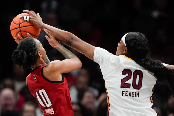 South Carolina forward Sania Feagin blocks a shot by. NC State guard Aziaha James during the first half of an NCAA women's college basketball game Sunday, Nov. 10, 2024, in Charlotte, N.C. (AP Photo/Chris Carlson)