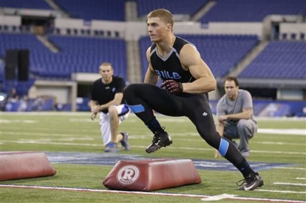 Montana linebacker Jordan Tripp runs a drill at the NFL football scouting combine in Indianapolis, Monday, Feb. 24, 2014. (Michael Conroy/The Associated Press)