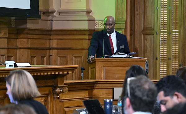 Michael Brunson Sr., from office of Secretary of State, speaks to State Election Board members during the State Election Board’s final scheduled meeting of 2024 at Georgia Capitol, Tuesday, October 8, 2024, in Atlanta. (Hyosub Shin / AJC)