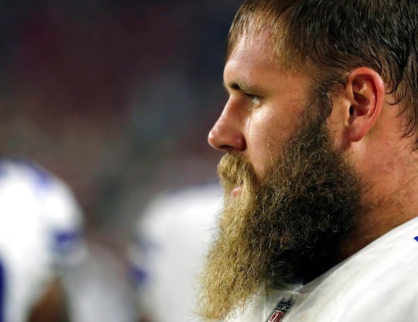 FILE - In this Sept. 25, 2017, file photo, Dallas Cowboys center Travis Frederick looks on from the sidelines during an NFL football game against the Arizona Cardinals,in Glendale, Ariz. Frederick's revelation that he is battling a rare neurological disorder will reverberate on and off the field for the Dallas Cowboys. They're likely to begin the season without their stalwart at center, and without knowing what will happen with their teammate's recovery. (AP Photo/Rick Scuteri, File)