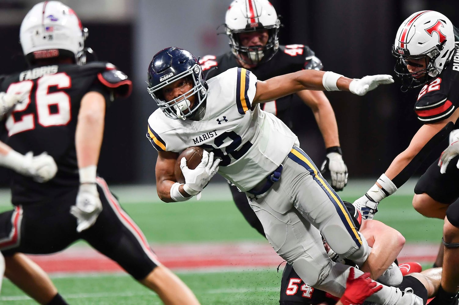 Marist’s Brayden Lewis (32) is brought down by North Oconee’s Nolan Bloom (54) during the second half of a Class 4A championship game at the Mercedes-Benz Stadium Monday, Dec. 16, 2024. (Photo/Daniel Varnado)